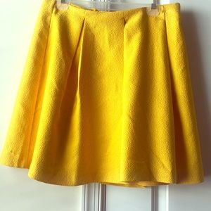 Yellow pleated skirt